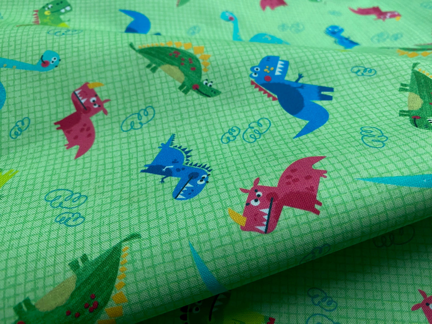 Kinderstoff Dinos Grün kariert