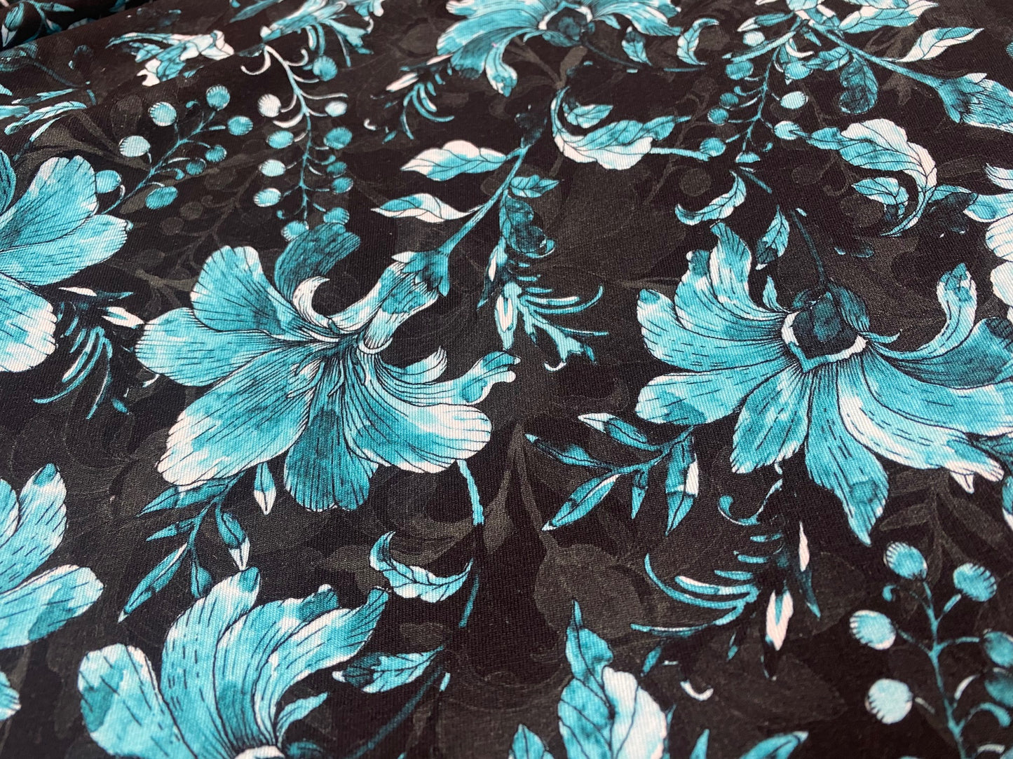 Viskose-Jersey Lilien Türkis Schwarz