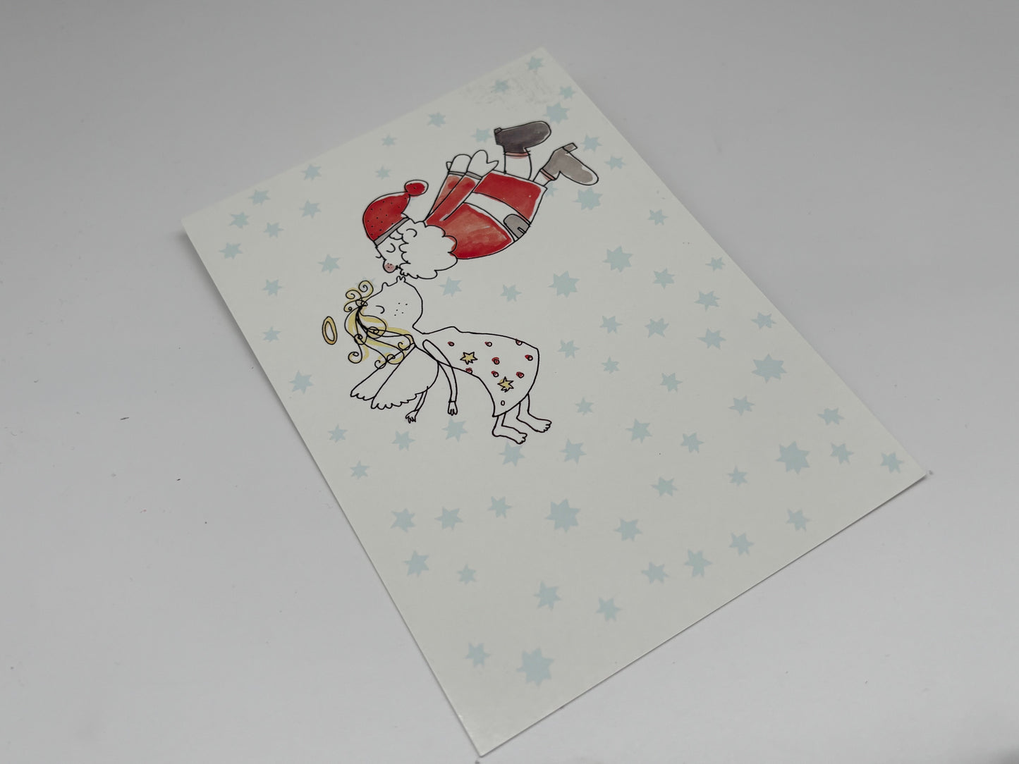 Postkarte Weihnachtsmann küsst Engel