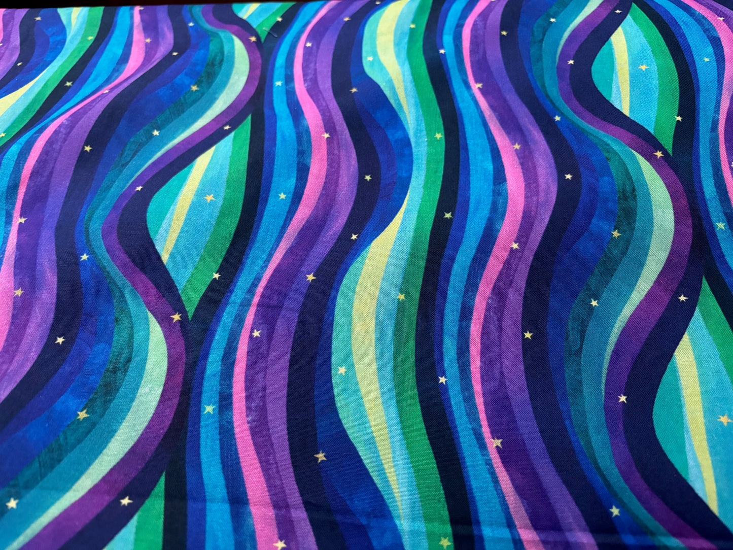 Baumwollstoff Northern Lights Wellen und Sterne