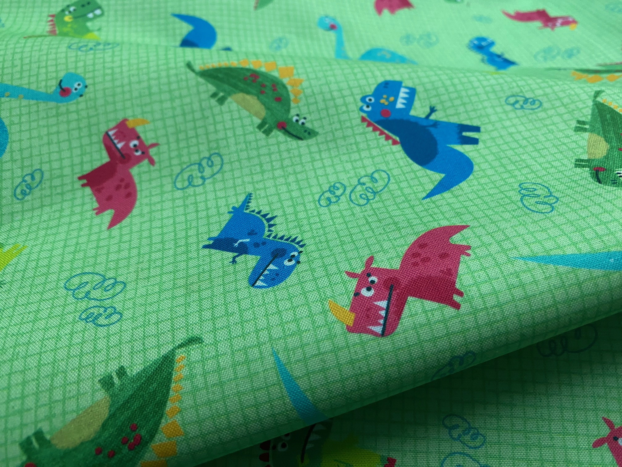 Kinderstoff Dinos Grün kariert Micheal Miller Kinderstoff Dinos Grün kariert Micheal Miller