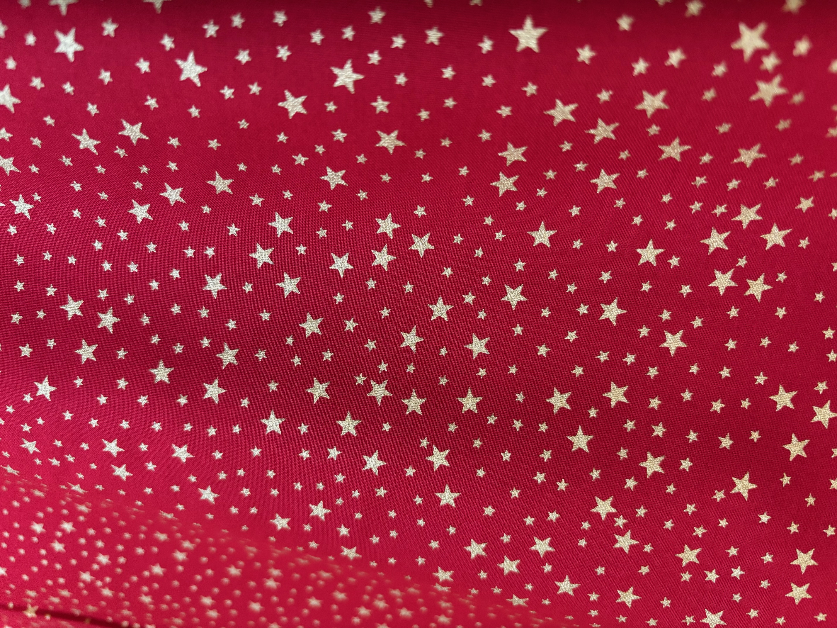 Weihnachtsstoff Glitzernder Sternenhimmel Rot/Gold